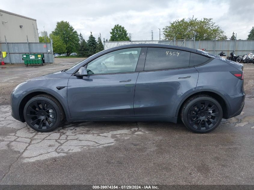 2023 Tesla Model Y VIN: 7SAYGDEE2PF877629 Lot: 39974354