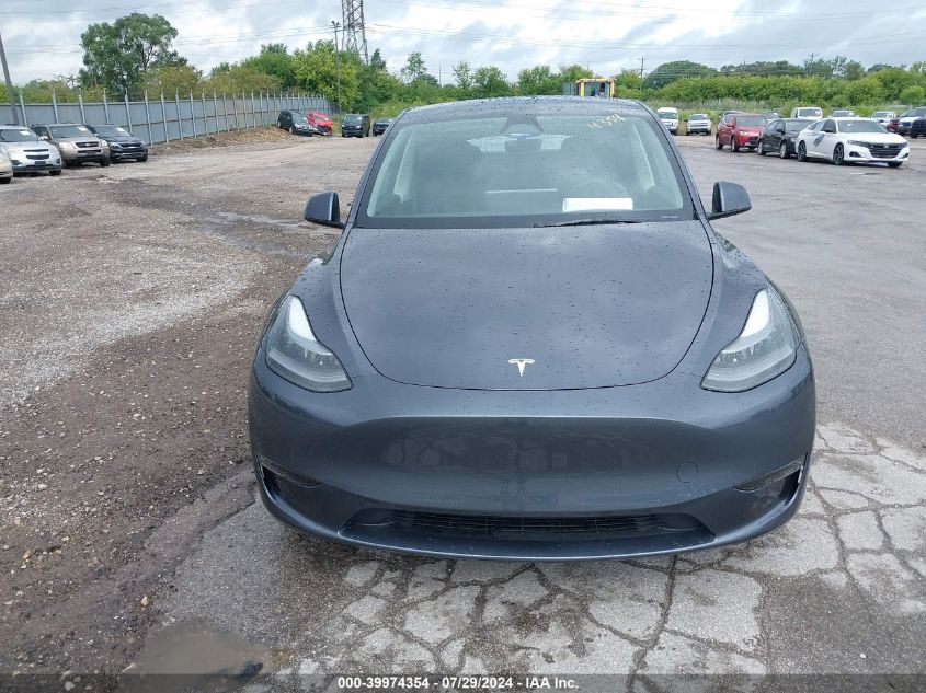 2023 Tesla Model Y VIN: 7SAYGDEE2PF877629 Lot: 39974354