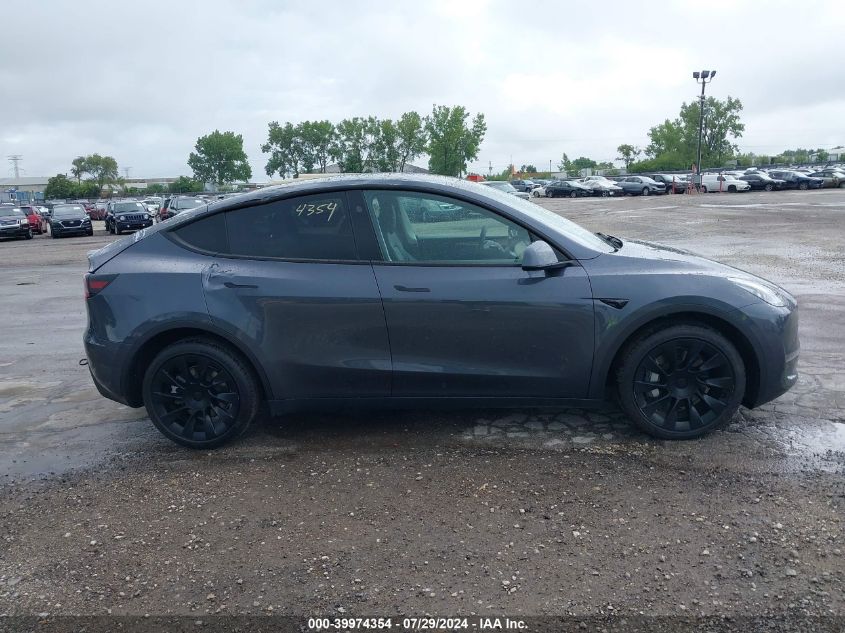 2023 Tesla Model Y VIN: 7SAYGDEE2PF877629 Lot: 39974354