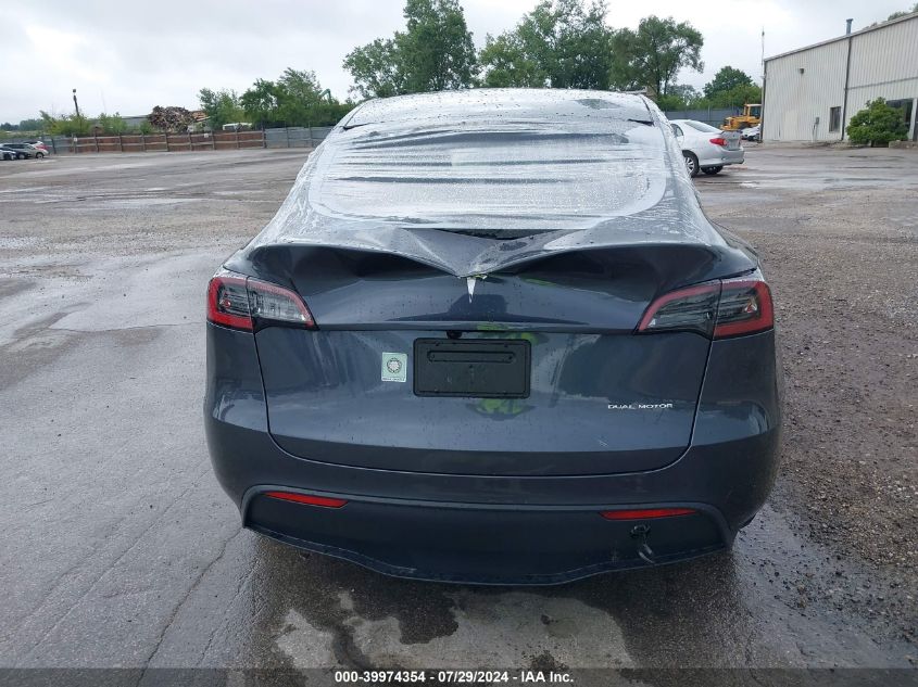 2023 Tesla Model Y VIN: 7SAYGDEE2PF877629 Lot: 39974354