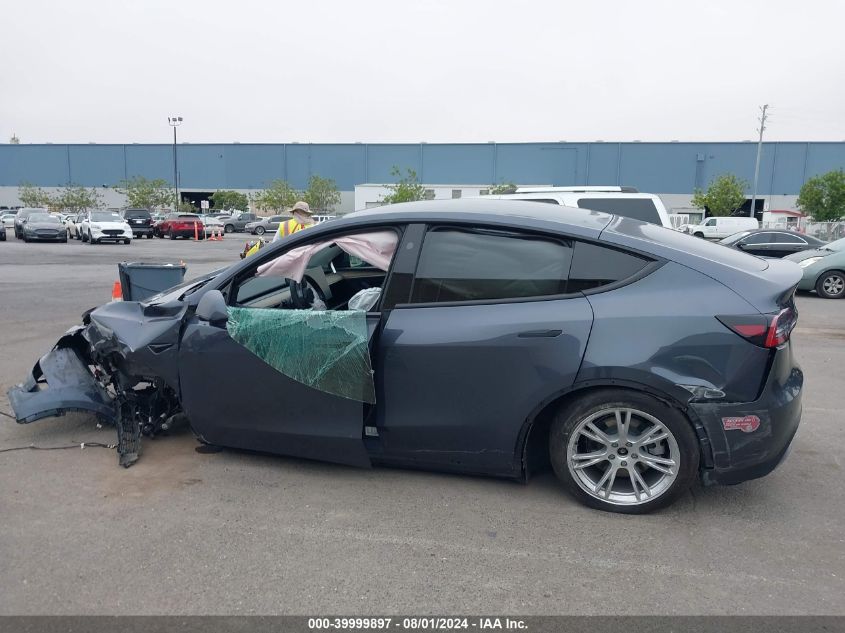 2023 Tesla Model Y Awd/Long Range Dual Motor All-Wheel Drive VIN: 7SAYGDEE8PF825728 Lot: 39999897