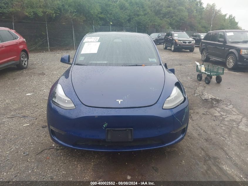 2023 Tesla Model Y VIN: 7SAYGDEF1PF707092 Lot: 40002552