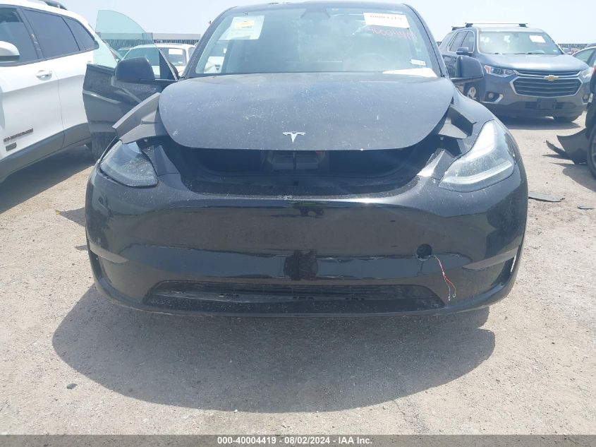 2023 Tesla Model Y VIN: 7SAYGAEE6PF595668 Lot: 40004419