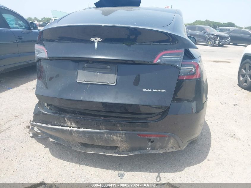 2023 Tesla Model Y VIN: 7SAYGAEE6PF595668 Lot: 40004419