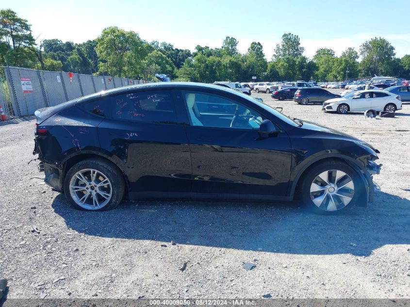 2023 Tesla Model Y Awd/Long Range Dual Motor All-Wheel Drive VIN: 7SAYGDEE8PF630521 Lot: 40009050