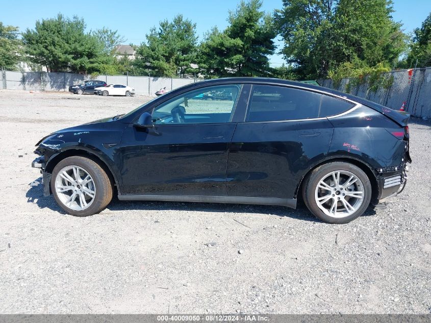 2023 Tesla Model Y Awd/Long Range Dual Motor All-Wheel Drive VIN: 7SAYGDEE8PF630521 Lot: 40009050