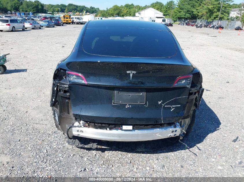 2023 Tesla Model Y Awd/Long Range Dual Motor All-Wheel Drive VIN: 7SAYGDEE8PF630521 Lot: 40009050