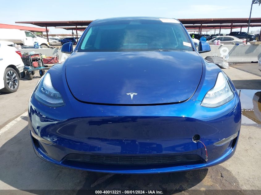 2023 Tesla Model Y Awd/Long Range Dual Motor All-Wheel Drive VIN: 7SAYGDEEXPA084835 Lot: 40013221