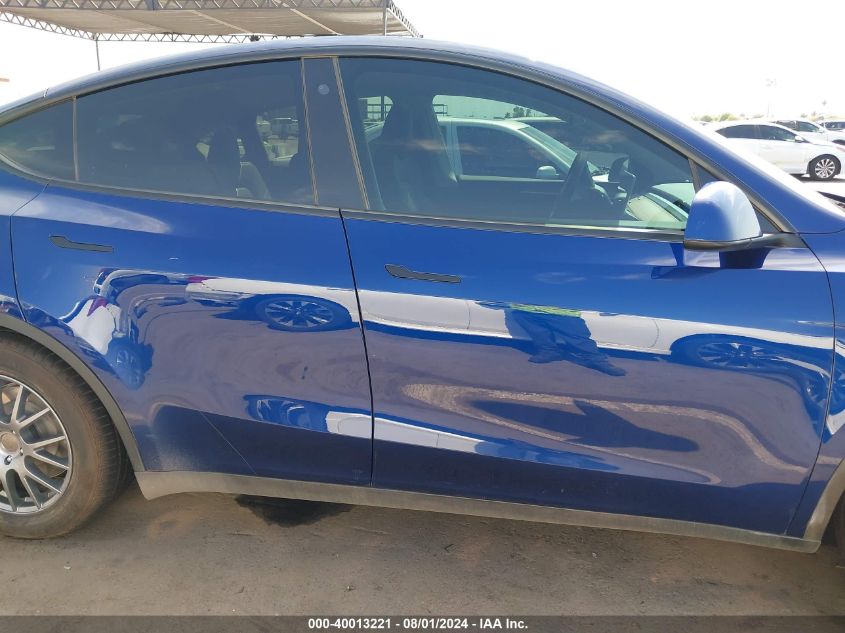 2023 Tesla Model Y Awd/Long Range Dual Motor All-Wheel Drive VIN: 7SAYGDEEXPA084835 Lot: 40013221