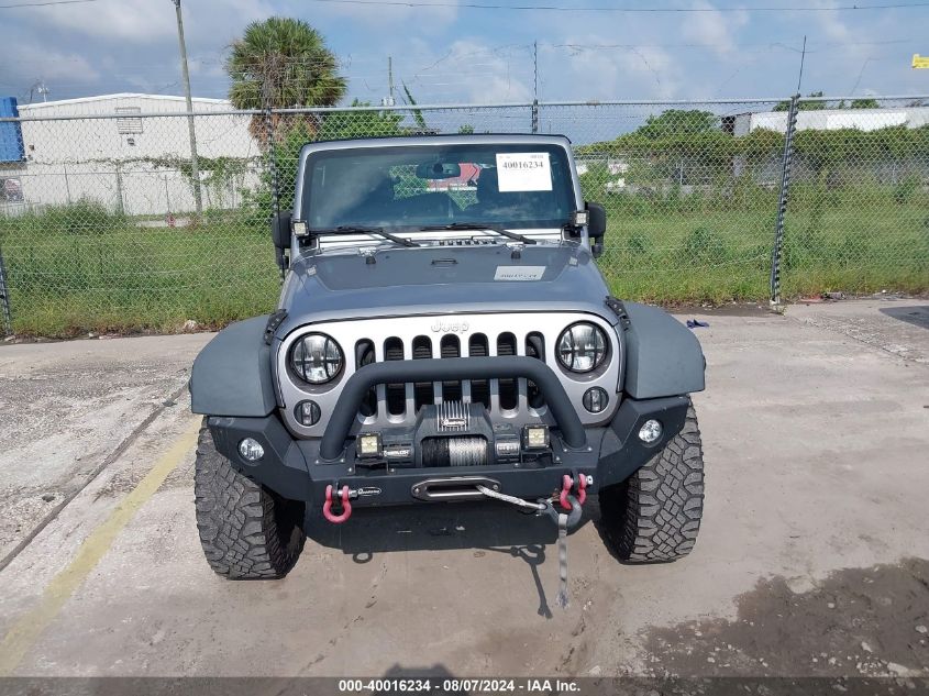 2014 Jeep Wrangler Unlimited Sport VIN: 1C4BJWDG7EL100909 Lot: 40016234