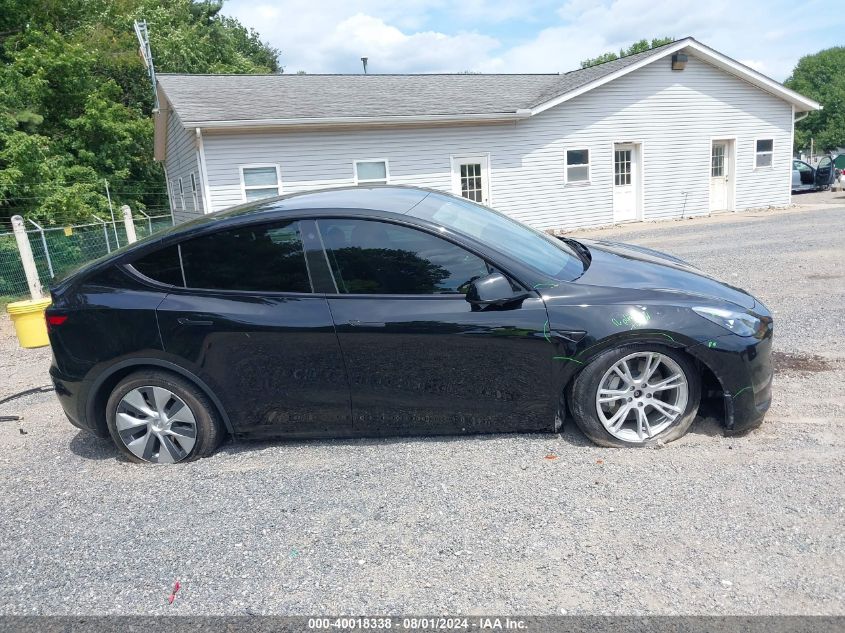 2023 Tesla Model Y Awd/Long Range Dual Motor All-Wheel Drive VIN: 7SAYGDEE9PF663298 Lot: 40018338