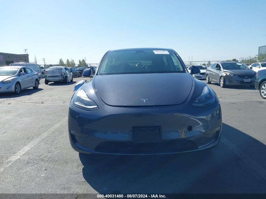 2023 Tesla Model Y Awd/Long Range Dual Motor All-Wheel Drive VIN: 7SAYGAEE9PF738841 Lot: 40031480