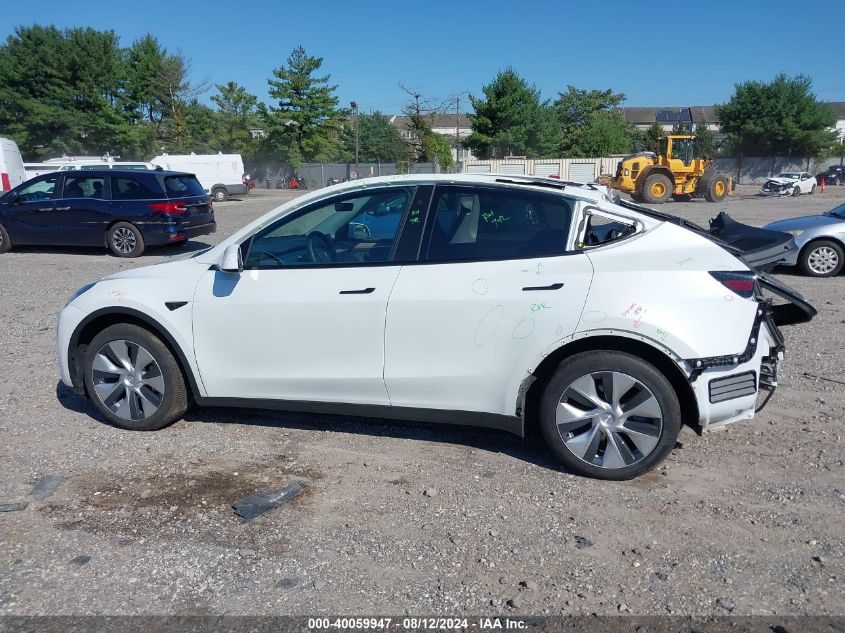 2023 Tesla Model Y Awd/Long Range Dual Motor All-Wheel Drive VIN: 7SAYGDEE2PF704533 Lot: 40059947