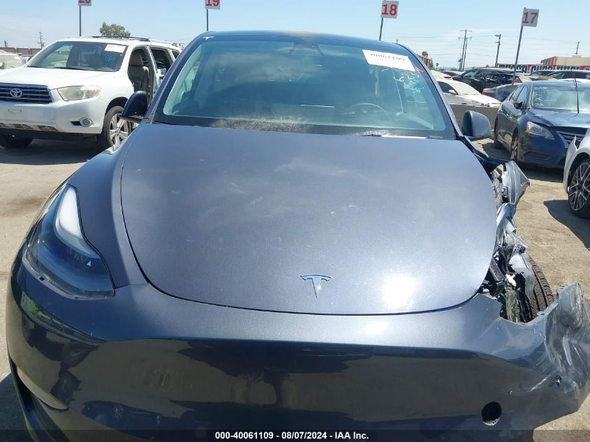 2023 Tesla Model Y Awd/Long Range Dual Motor All-Wheel Drive VIN: 7SAYGAEEXPF594510 Lot: 40061109