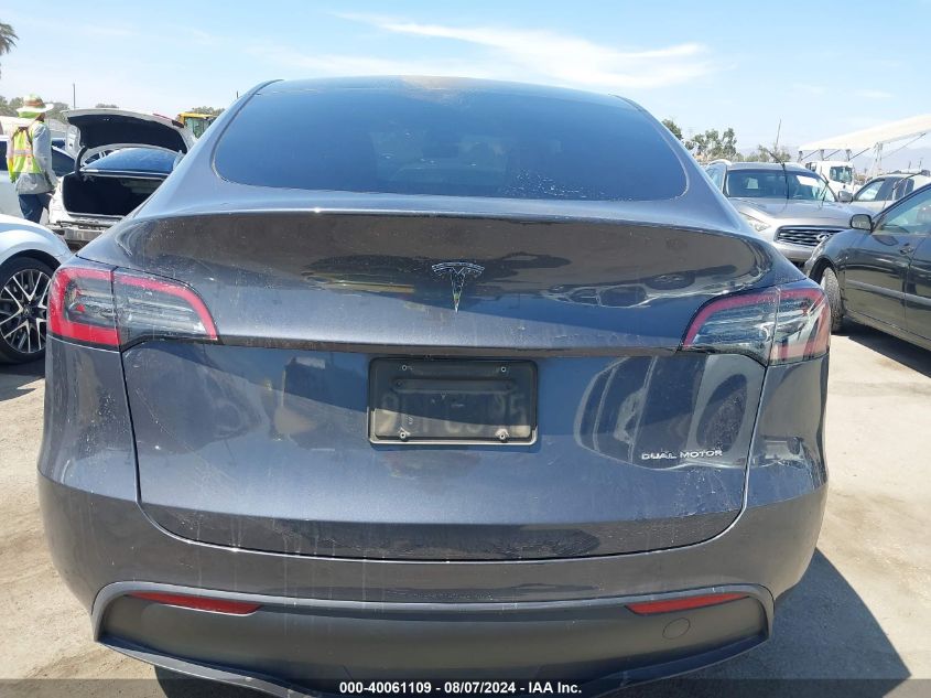 2023 Tesla Model Y Awd/Long Range Dual Motor All-Wheel Drive VIN: 7SAYGAEEXPF594510 Lot: 40061109