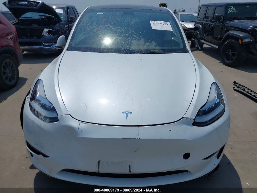 2023 Tesla Model Y Awd/Long Range Dual Motor All-Wheel Drive VIN: 7SAYGDEE7PA074747 Lot: 40069179