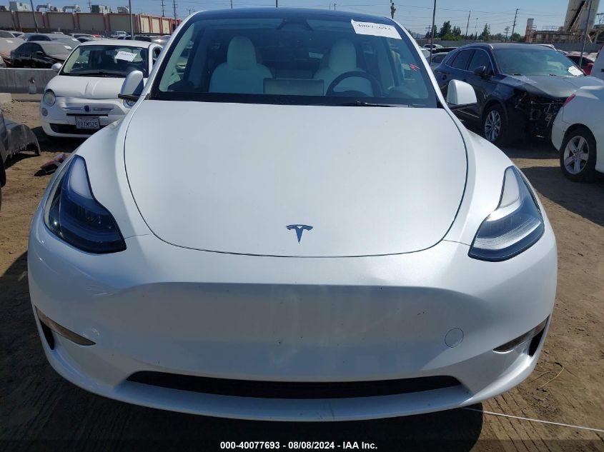 2023 Tesla Model Y Awd/Long Range Dual Motor All-Wheel Drive VIN: 7SAYGDEE0PF878276 Lot: 40077693