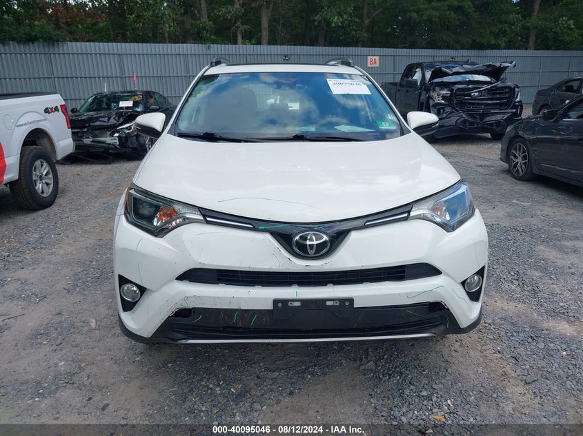 VIN JTMRFREV8JJ745704 2018 TOYOTA RAV4 XLE