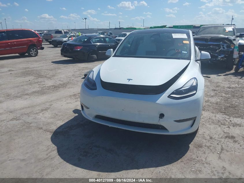 2023 Tesla Model Y Awd/Long Range Dual Motor All-Wheel Drive VIN: 7SAYGAEE0PF963102 Lot: 40127009