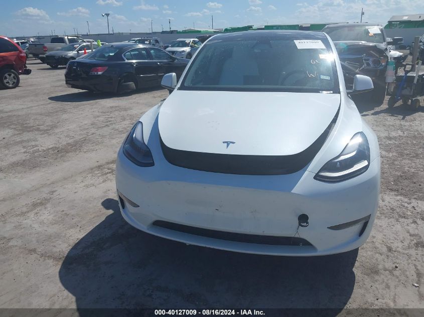 2023 Tesla Model Y Awd/Long Range Dual Motor All-Wheel Drive VIN: 7SAYGAEE0PF963102 Lot: 40127009