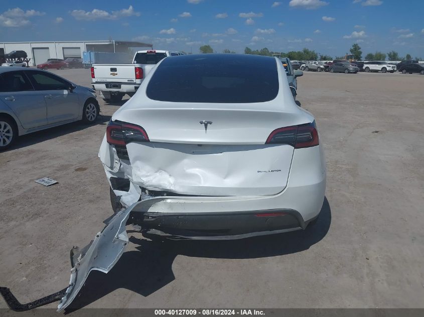 2023 Tesla Model Y Awd/Long Range Dual Motor All-Wheel Drive VIN: 7SAYGAEE0PF963102 Lot: 40127009