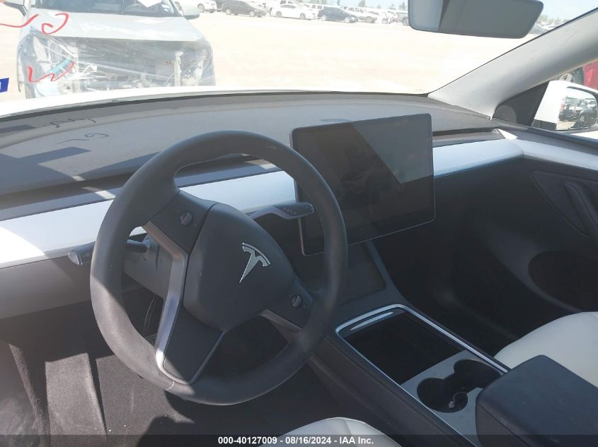 2023 Tesla Model Y Awd/Long Range Dual Motor All-Wheel Drive VIN: 7SAYGAEE0PF963102 Lot: 40127009