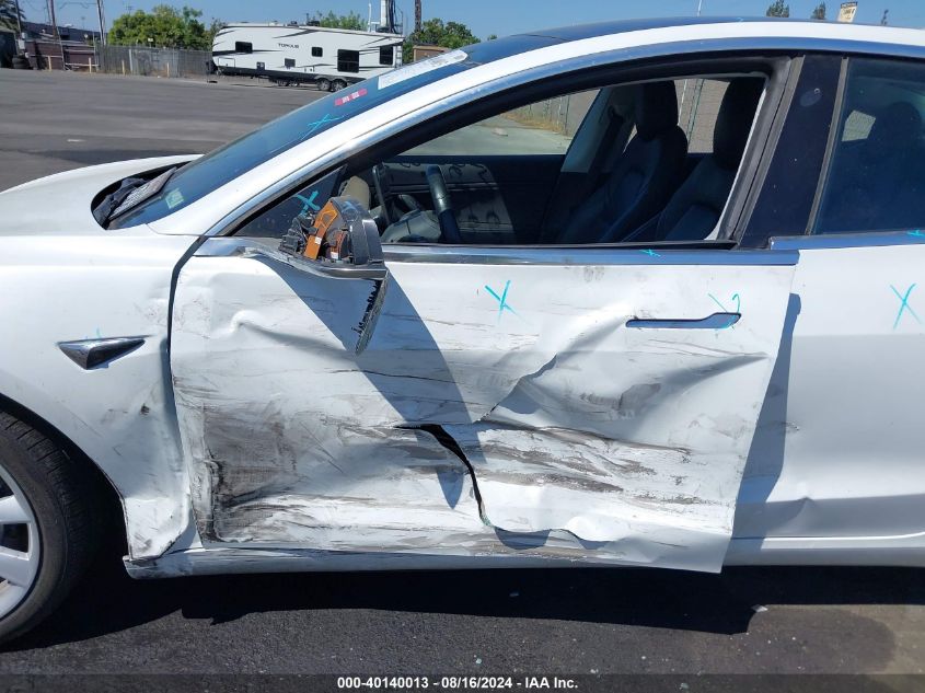 2018 Tesla Model 3 Long Range/Performance VIN: 5YJ3E1EB6JF067719 Lot: 40140013