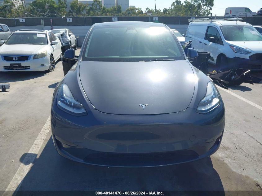 2023 Tesla Model Y Awd/Long Range Dual Motor All-Wheel Drive VIN: 7SAYGDEE4PA031287 Lot: 40141476