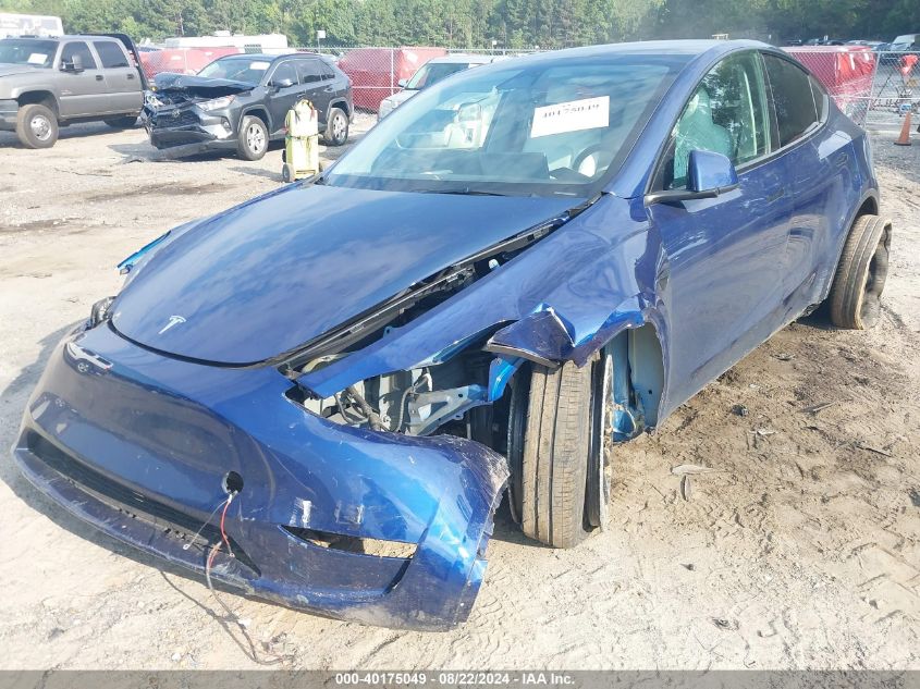 2023 Tesla Model Y Awd/Long Range Dual Motor All-Wheel Drive VIN: 7SAYGDEE7PF710456 Lot: 40175049