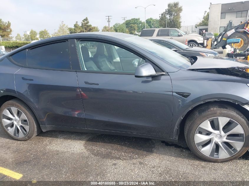 2023 Tesla Model Y Awd/Long Range Dual Motor All-Wheel Drive VIN: 7SAYGDEE2PA075711 Lot: 40180585