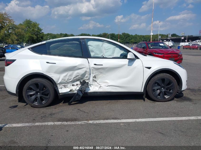 2023 Tesla Model Y Awd/Long Range Dual Motor All-Wheel Drive VIN: 7SAYGDEE7PA097672 Lot: 40216548