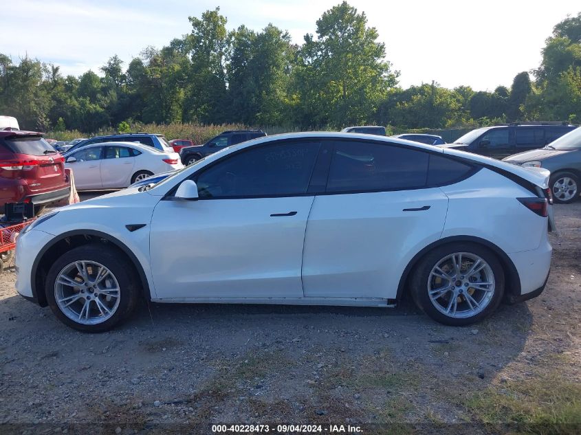 2023 Tesla Model Y Awd/Long Range Dual Motor All-Wheel Drive VIN: 7SAYGDEE4PA042290 Lot: 40228473