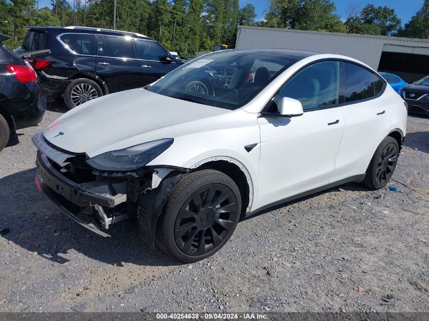 2023 Tesla Model Y Awd/Long Range Dual Motor All-Wheel Drive VIN: 7SAYGAEE7PF701268 Lot: 40254638