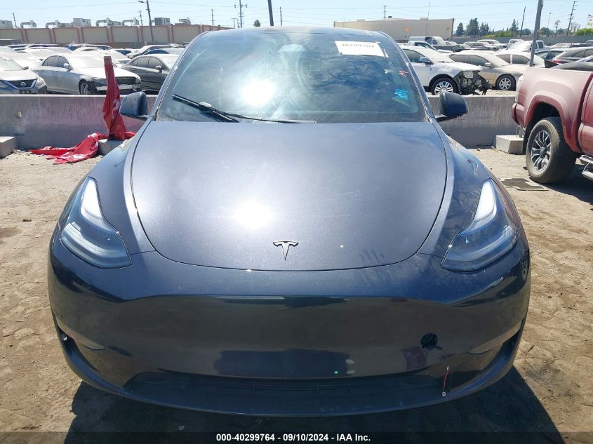 2024 Tesla Model Y VIN: 7SAYGDED7RF101989 Lot: 40299764