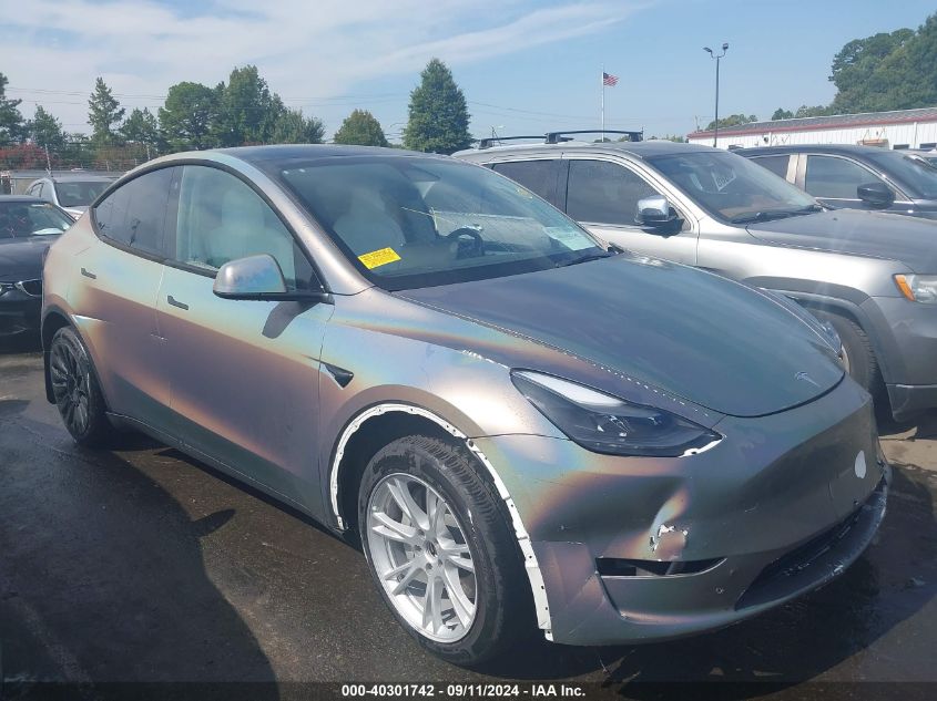 2023 Tesla Model Y Awd/Long Range Dual Motor All-Wheel Drive VIN: 7SAYGDEE0PF671483 Lot: 40301742