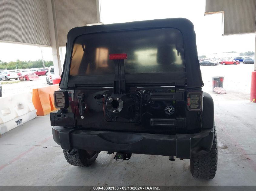 2015 Jeep Wrangler Unlimited Freedom Edition/Sport/Willys Wheeler VIN: 1C4BJWDG9FL732165 Lot: 40302133