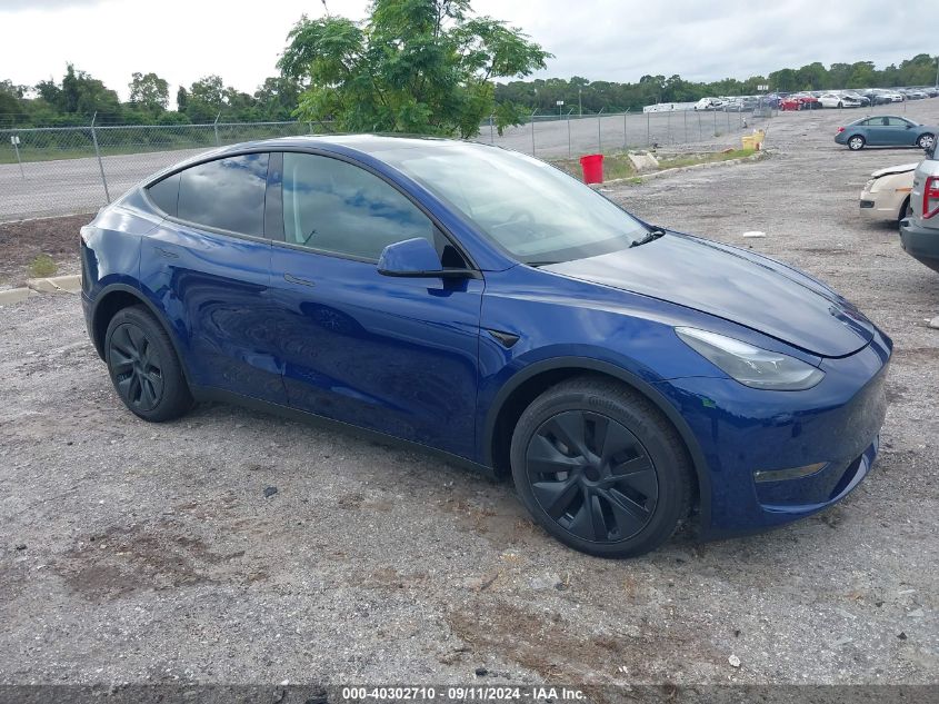 2024 Tesla Model Y VIN: 7SAYGDEE0RA320489 Lot: 40302710