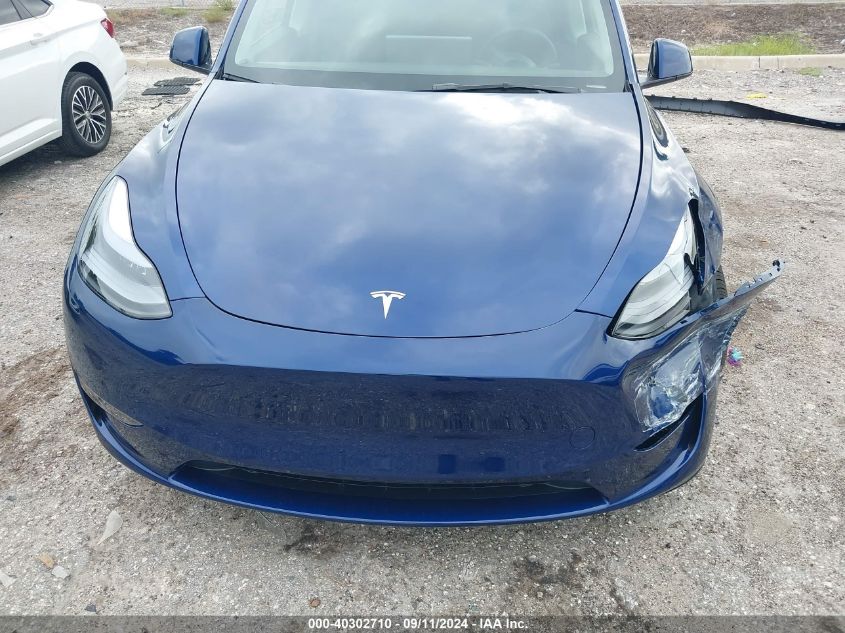 2024 Tesla Model Y VIN: 7SAYGDEE0RA320489 Lot: 40302710