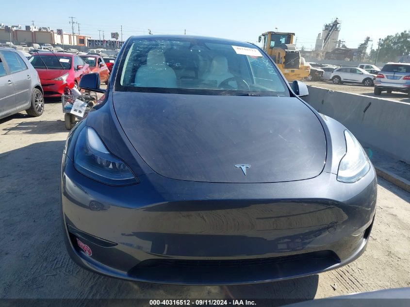 2023 Tesla Model Y Awd/Long Range Dual Motor All-Wheel Drive VIN: 7SAYGAEE2PF978359 Lot: 40316512