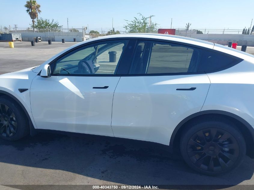 2023 Tesla Model Y Awd/Long Range Dual Motor All-Wheel Drive VIN: 7SAYGDEE3PA104780 Lot: 40343750