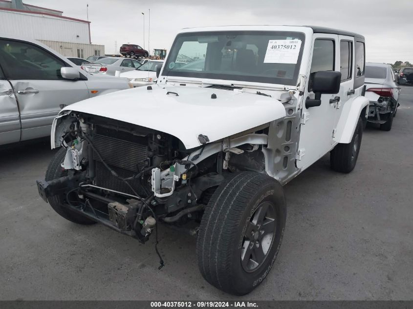 2015 Jeep Wrangler Unlimited Freedom Edition VIN: 1C4BJWDG7FL637037 Lot: 40375012