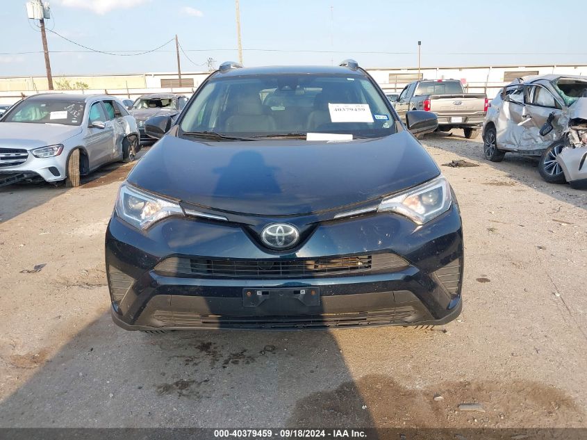 2T3ZFREV8HW360672 2017 Toyota Rav4 Le