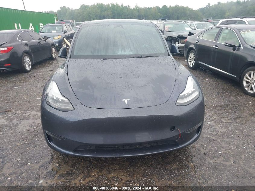 2023 Tesla Model Y VIN: 7SAYGDEE5PA071085 Lot: 40386046