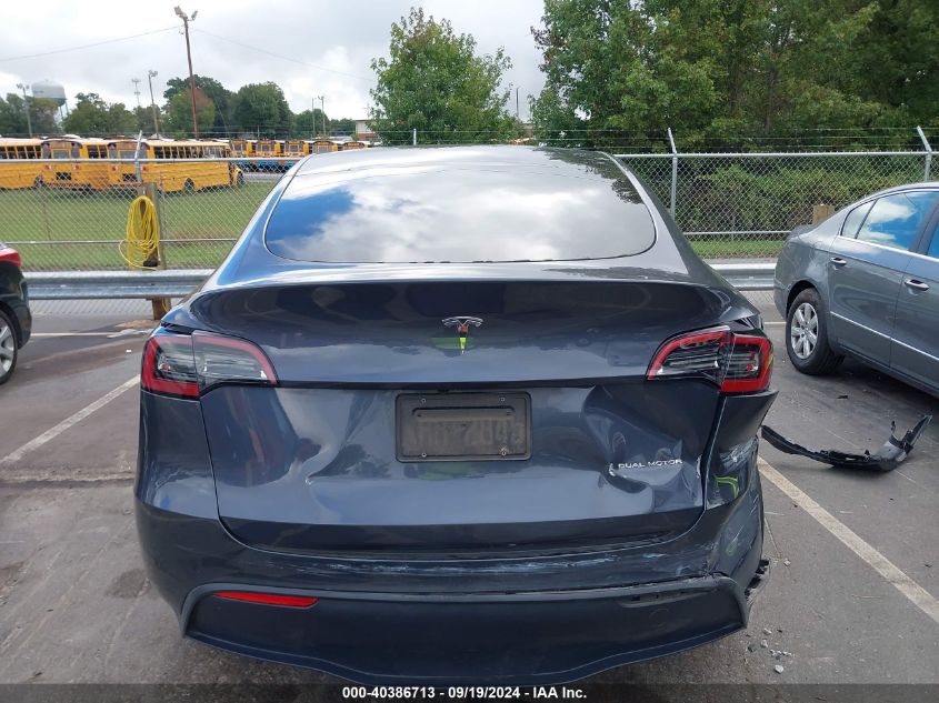 2023 Tesla Model Y Awd/Long Range Dual Motor All-Wheel Drive VIN: 7SAYGDEE8PF707310 Lot: 40386713