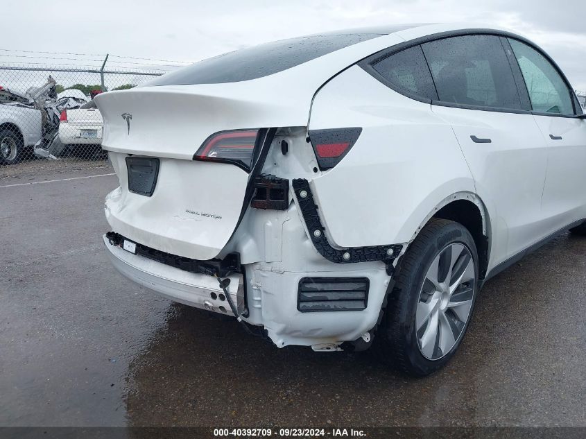 2023 Tesla Model Y Awd/Long Range Dual Motor All-Wheel Drive VIN: 7SAYGDEE5PF712612 Lot: 40392709