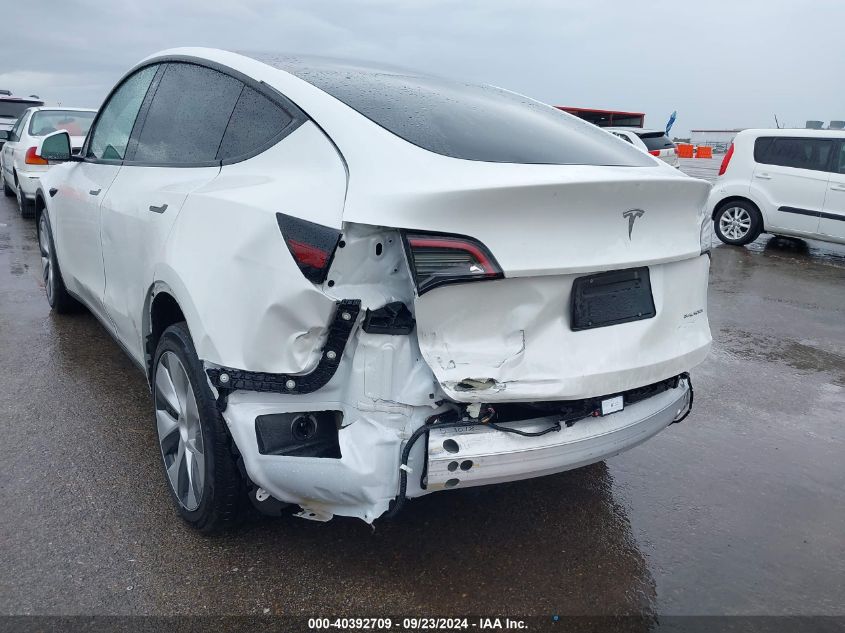 2023 Tesla Model Y Awd/Long Range Dual Motor All-Wheel Drive VIN: 7SAYGDEE5PF712612 Lot: 40392709