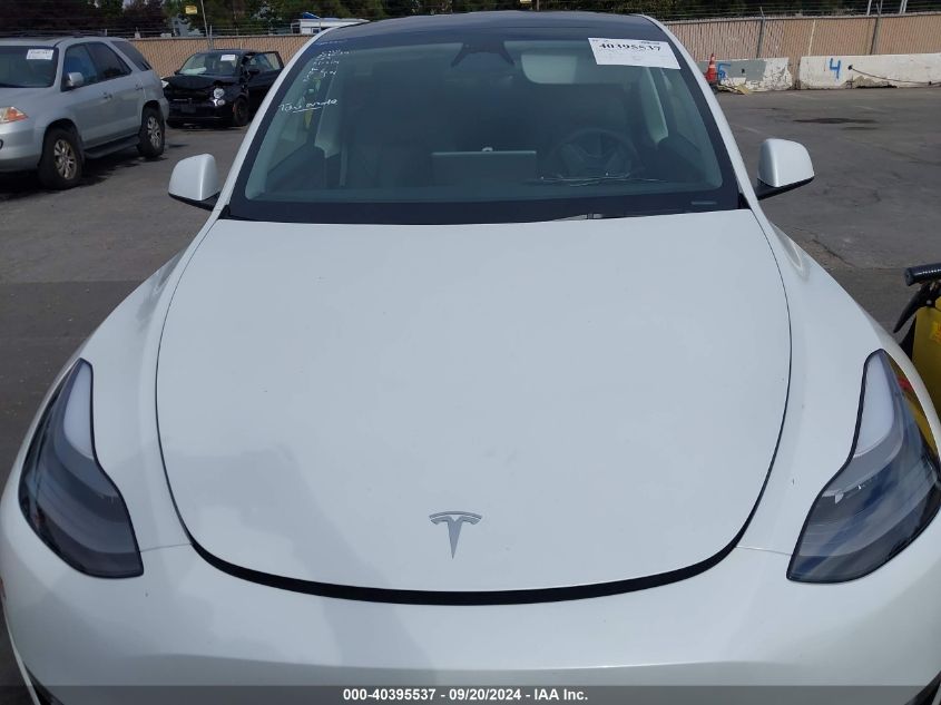 2023 Tesla Model Y Awd/Long Range Dual Motor All-Wheel Drive VIN: 7SAYGAEE8PF812623 Lot: 40395537