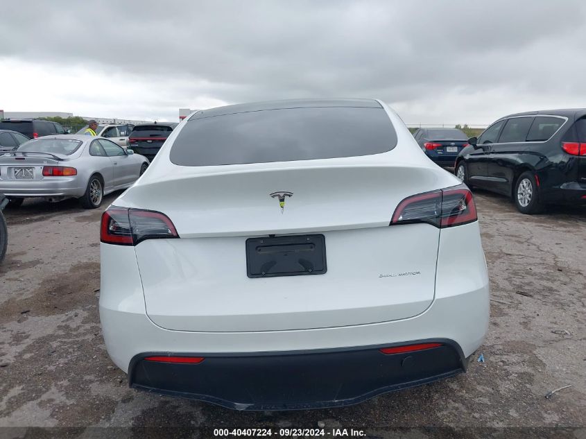 2023 Tesla Model Y Awd/Long Range Dual Motor All-Wheel Drive VIN: 7SAYGAEEXPF660828 Lot: 40407224