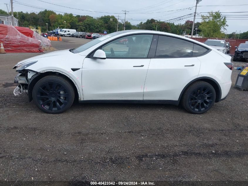 2023 Tesla Model Y Awd/Long Range Dual Motor All-Wheel Drive VIN: 7SAYGAEEXPF695529 Lot: 40423342