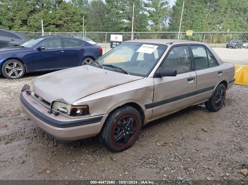 1994 Mazda Protege VIN: JM1BG2245RO766190 Lot: 40472660